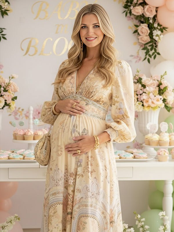 Beige floral boho maternity maxi dress with button-front shaped waistband, big swing hem and flowy silhouette, designed for baby shower.