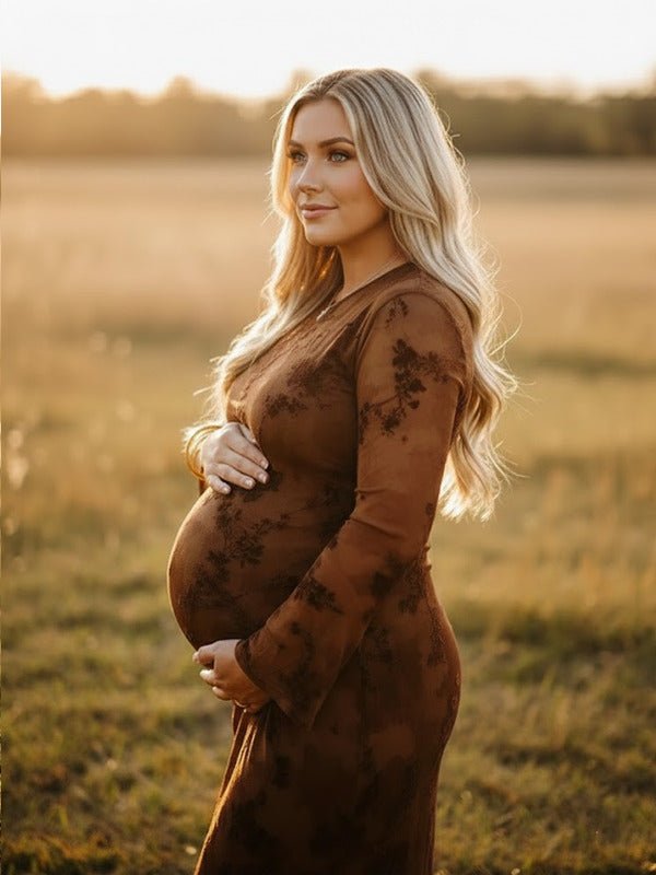 Dark brown printed maternity maxi dress with mesh ruffle ruched design and flowy silhouette, designed for photoshoot.
