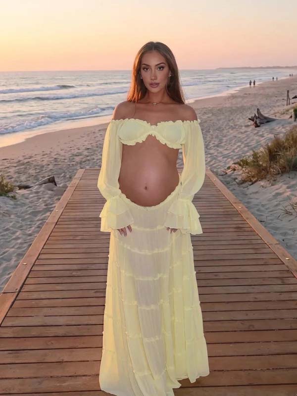 Yellow maternity maxi dress with off-shoulder ruffle crop top, two-piece design, and big swing silhouette, designed for baby shower and photoshoot.