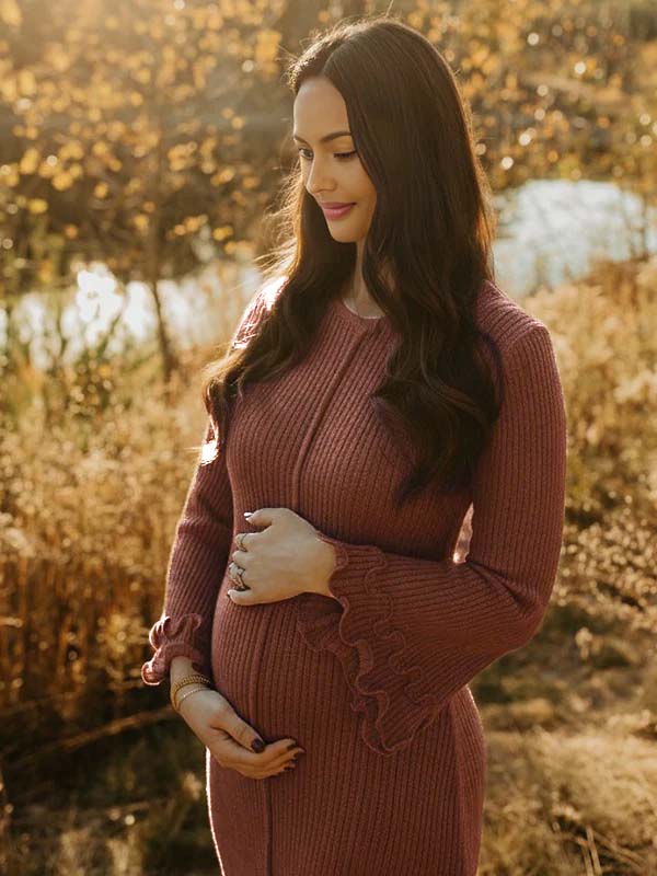 Brown knit maternity maxi dress with ruffle backless flare sleeve design and fitted silhouette, designed for photoshoot.
