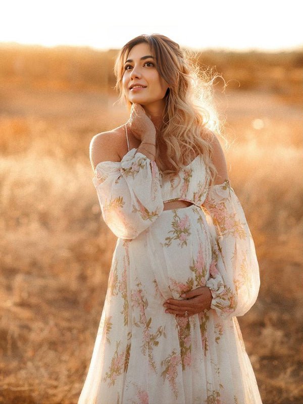 White floral maternity maxi dress with cut out off-shoulder cami, backless design and big swing silhouette for photoshoot.